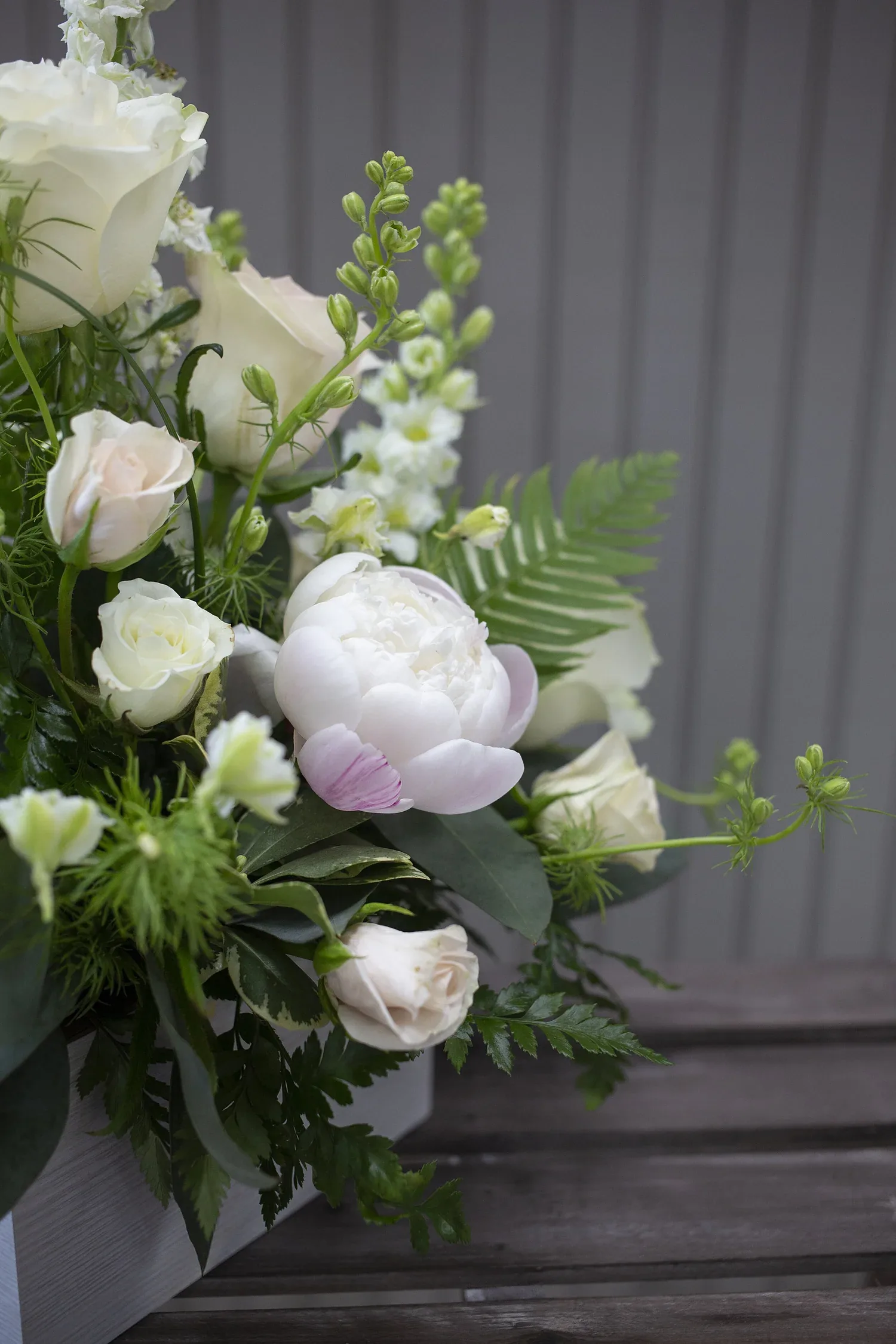 Abbott's designer selecting stems in the flower cooler