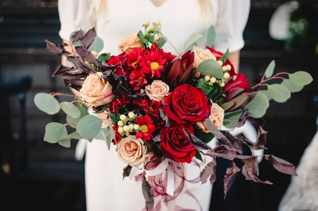Winter wedding bouquet with deep tones and texture