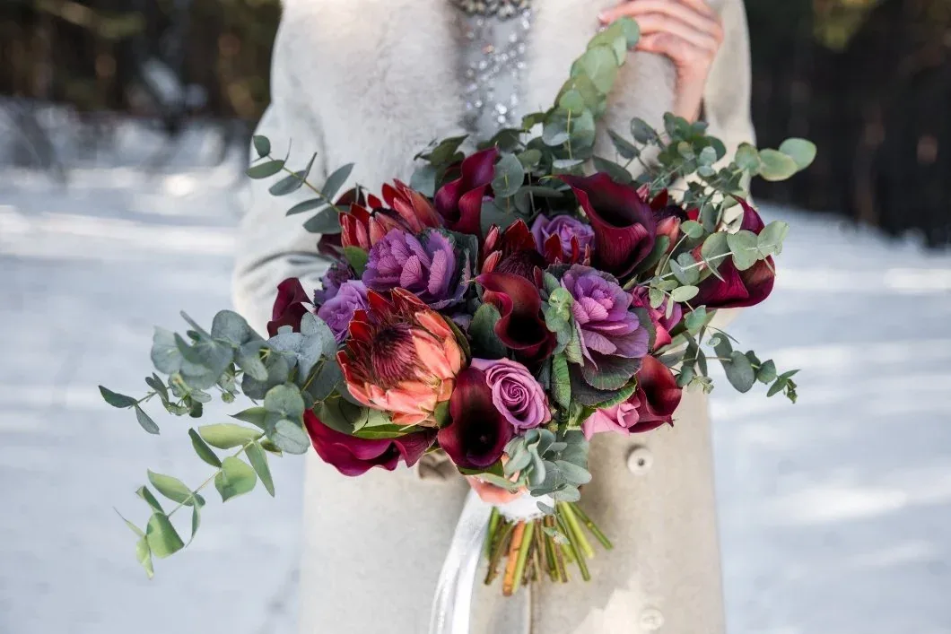 Textured winter bouquet with silvery foliage and berries